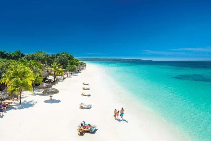 From Montego Bay: Negril Beach and Rick's Café Day Trip - Seven Mile Beach Free Time: Sun, Sand, and Water Fun