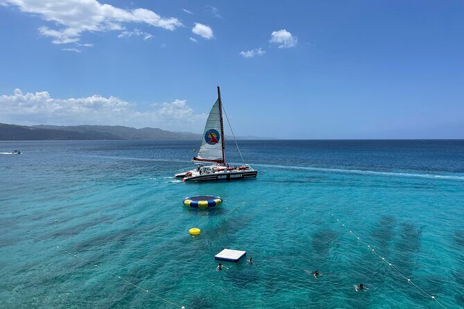 Half Day Catamaran Party Boat, Snorkeling and Hip Strip Tour - The boat vibe: front nets, music, and crew energy